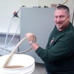 Beardsley fills a bucket for fermenting - 800 dpi