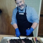 Chris Sanzaro slicing the brisket at Hope Church - Copy