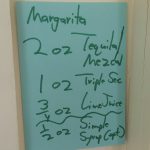 Gregg's Margarita recipe taped to the wall for ready reference.